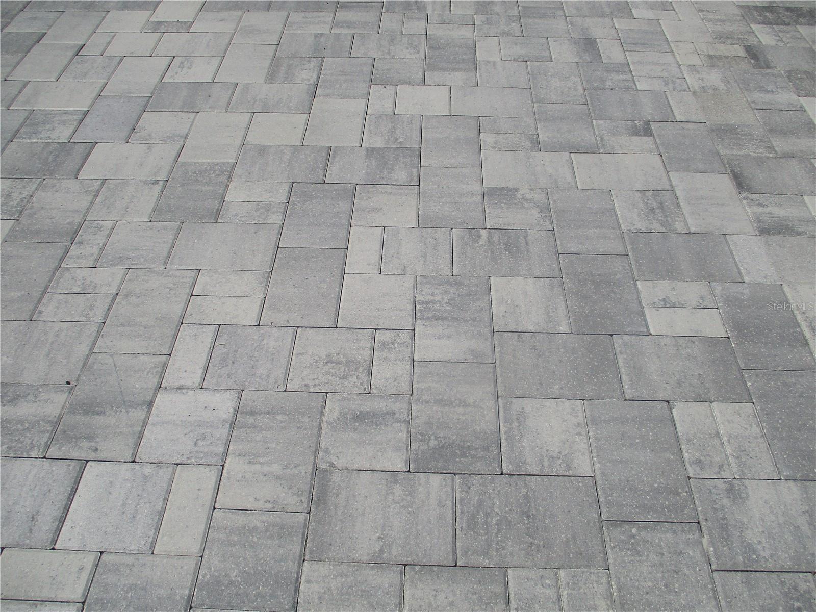 ALL NEW PAVERS SURROUND THE LANDSCAPE.