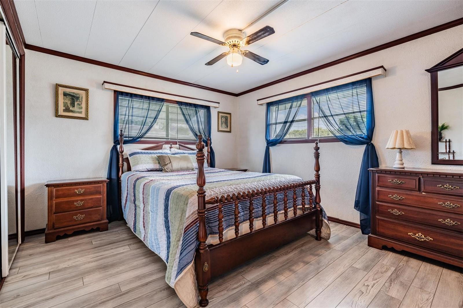 Relaxing bedroom with updated laminate floors