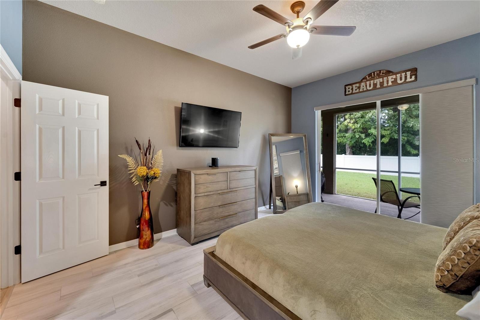 Over-Sized Sliding Glass doors wih a View of the Covered Porch.