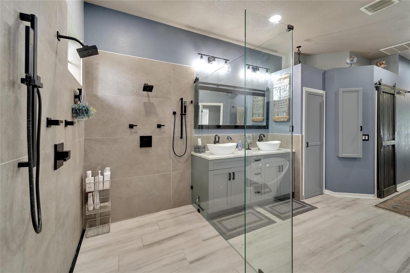 Now this is a true walk-shower.  Check out those amazing shower heads.