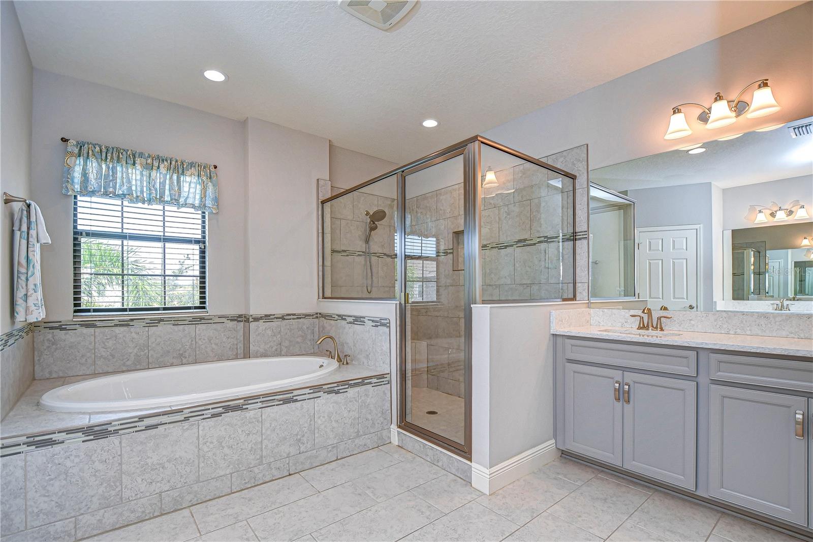 Walk-in shower, garden tub, and dual vanities!