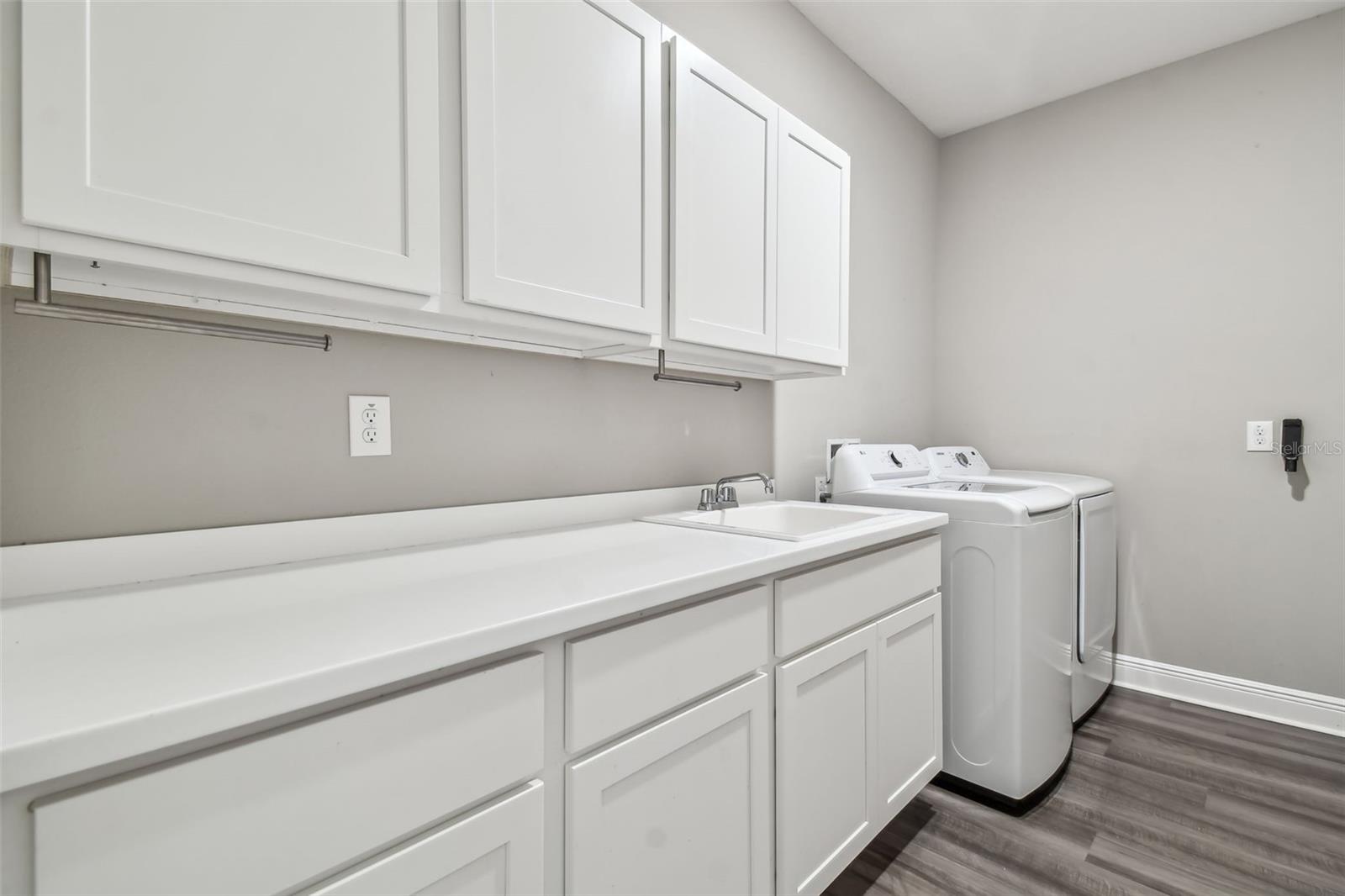 Laundry room with more storage.