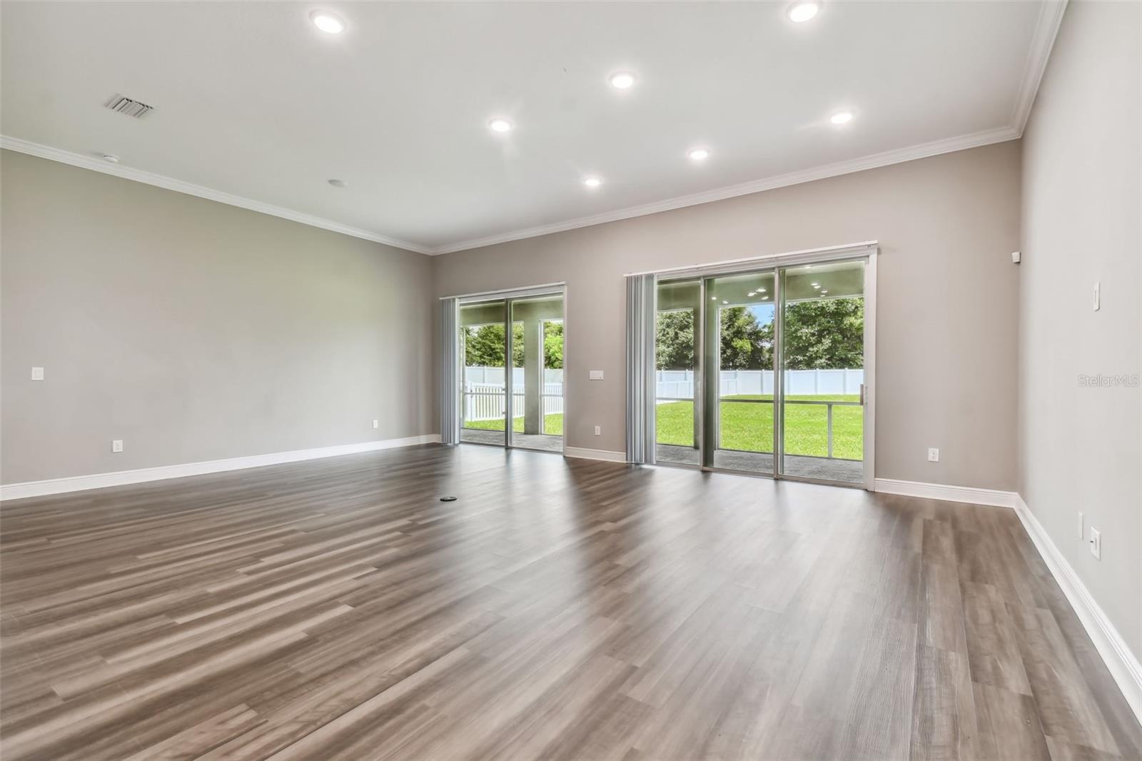 Double sliders in the family room leading to the screened lanai.