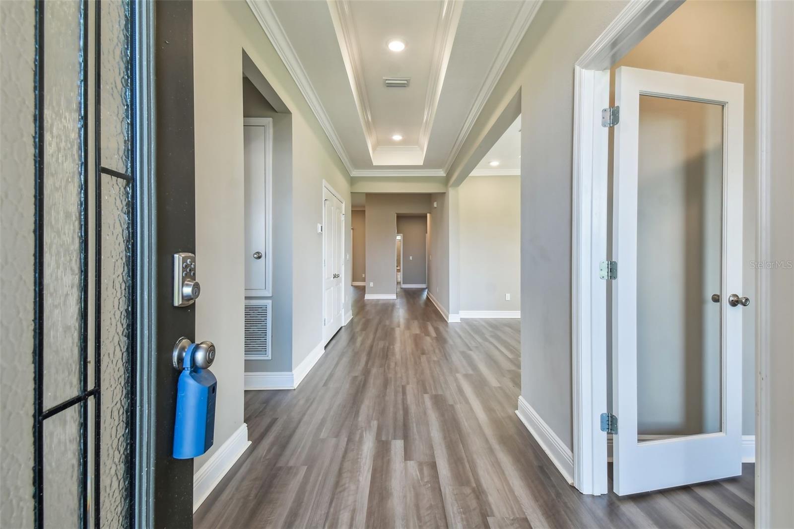 Upon entering, there is a large den/office to the right, 3-way split bedroom with bath to the left and then the flex space to the right.