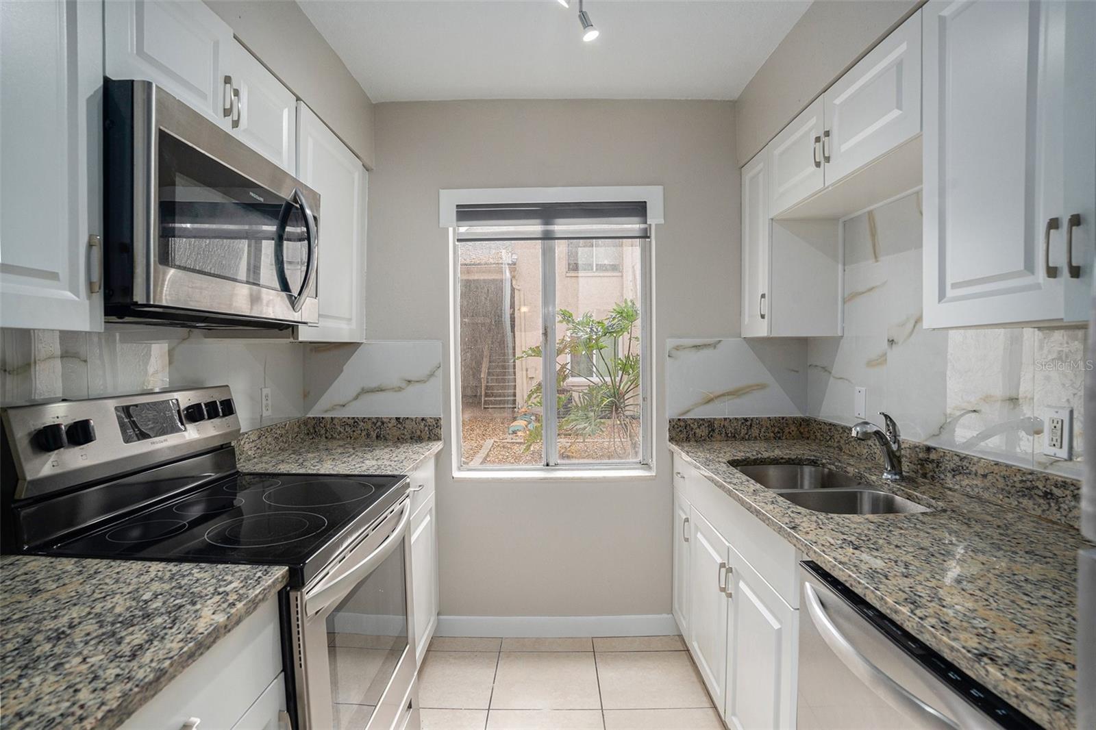 Kitchen- with granite countertops and stainless steel appliances