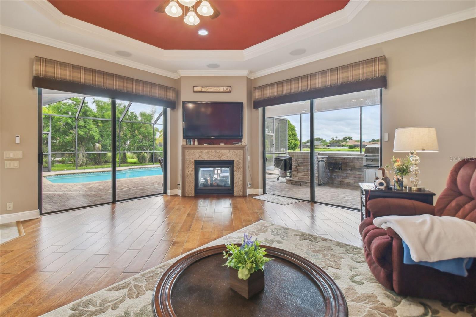 Family room has dbl sided gas fireplace.