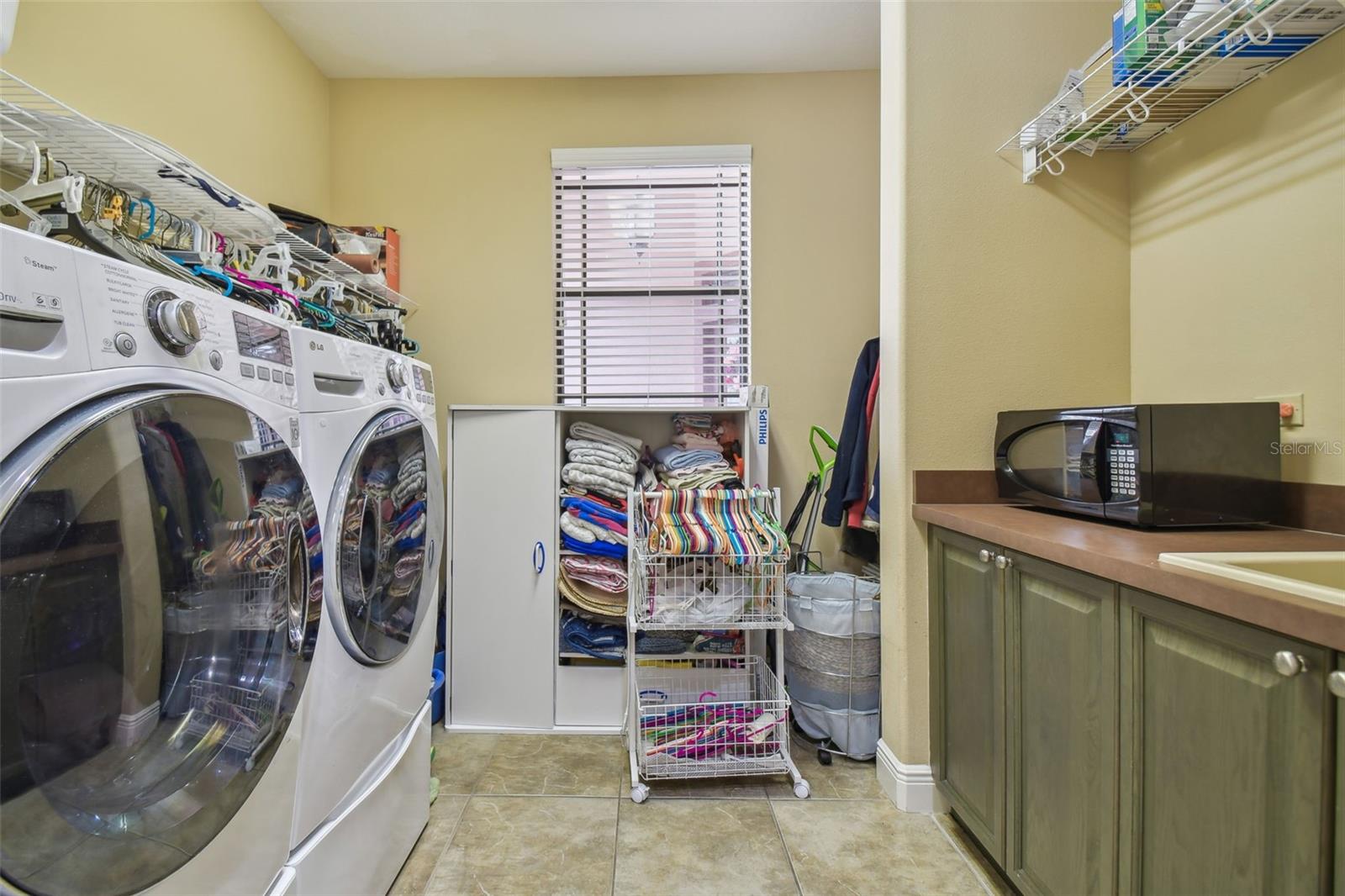 Laundry room includes front load washer & dryer.