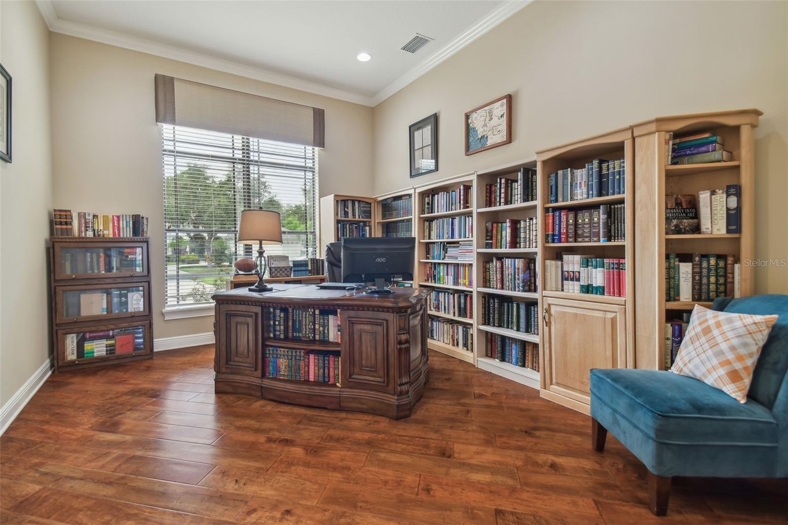 Spacious den with french doors.