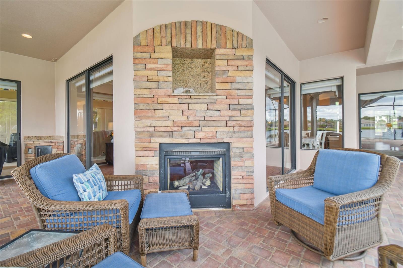 Cabana with sitting area by the gas fireplace.