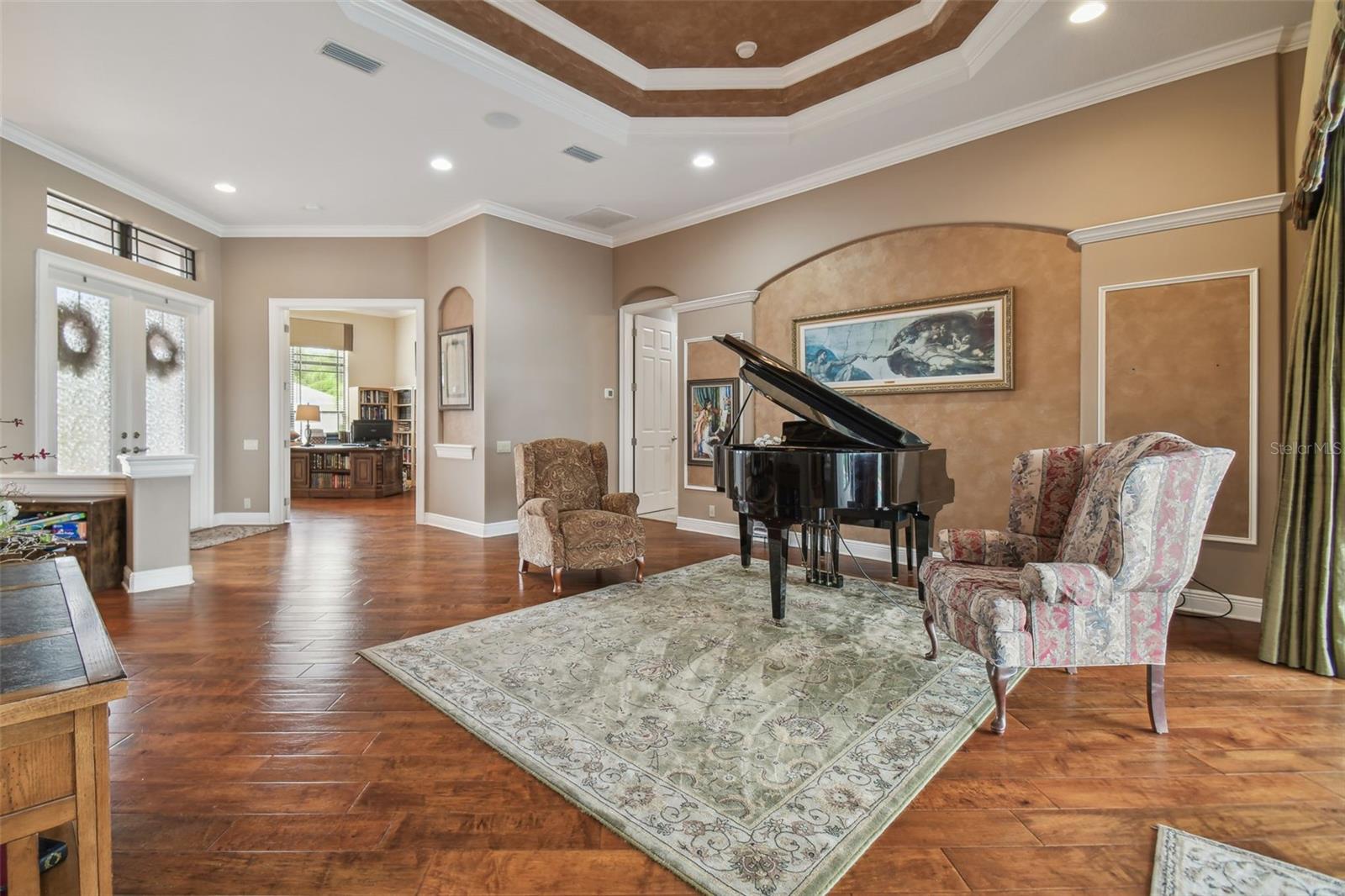 Formal living room with tray ceiling.