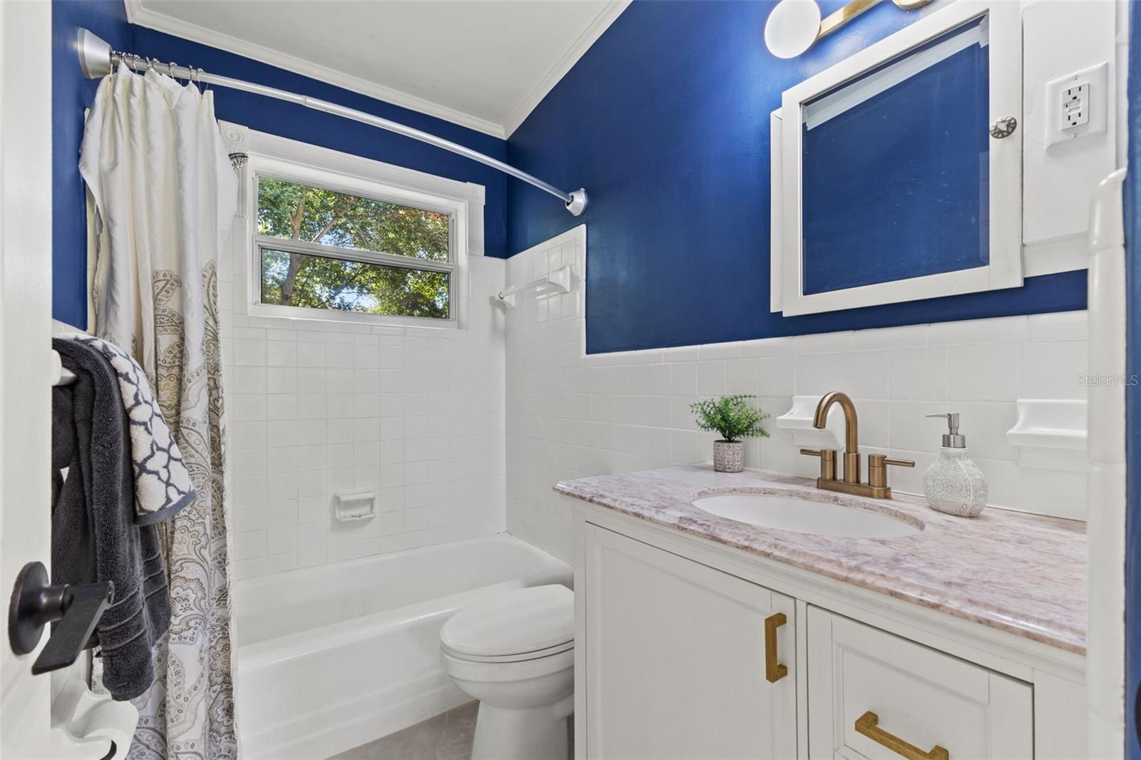 Updated bathroom with natural light.