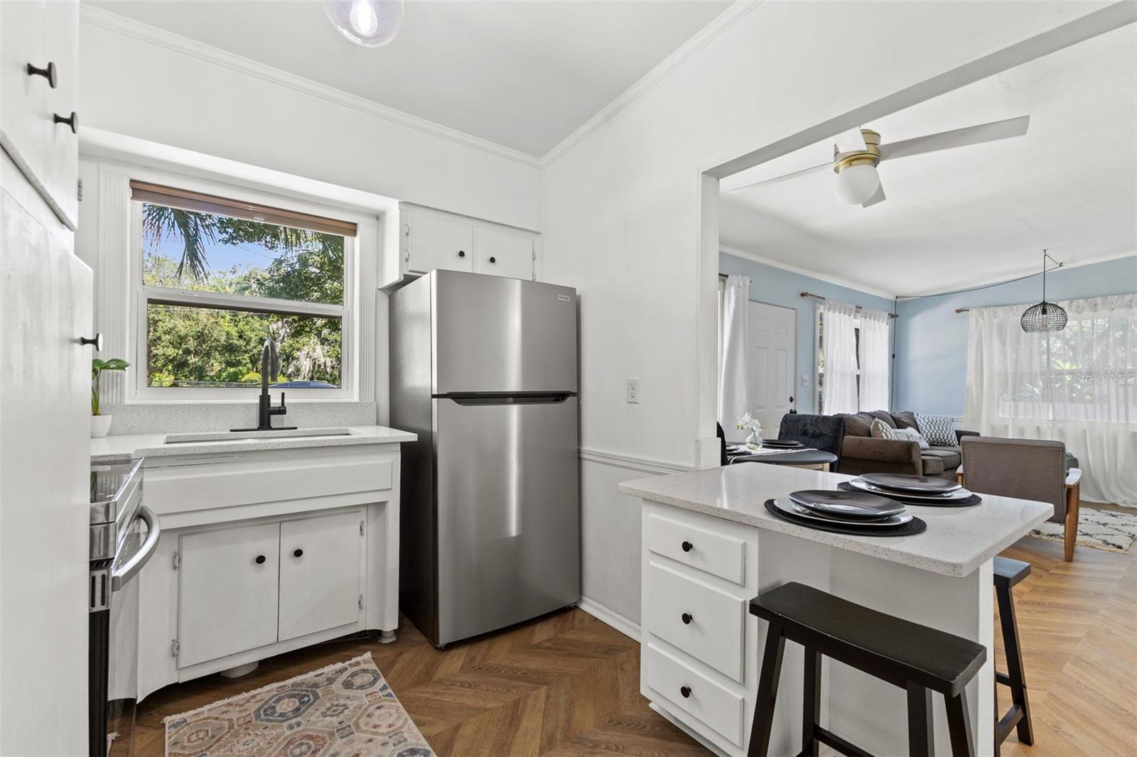 Kitchen view open to living room.