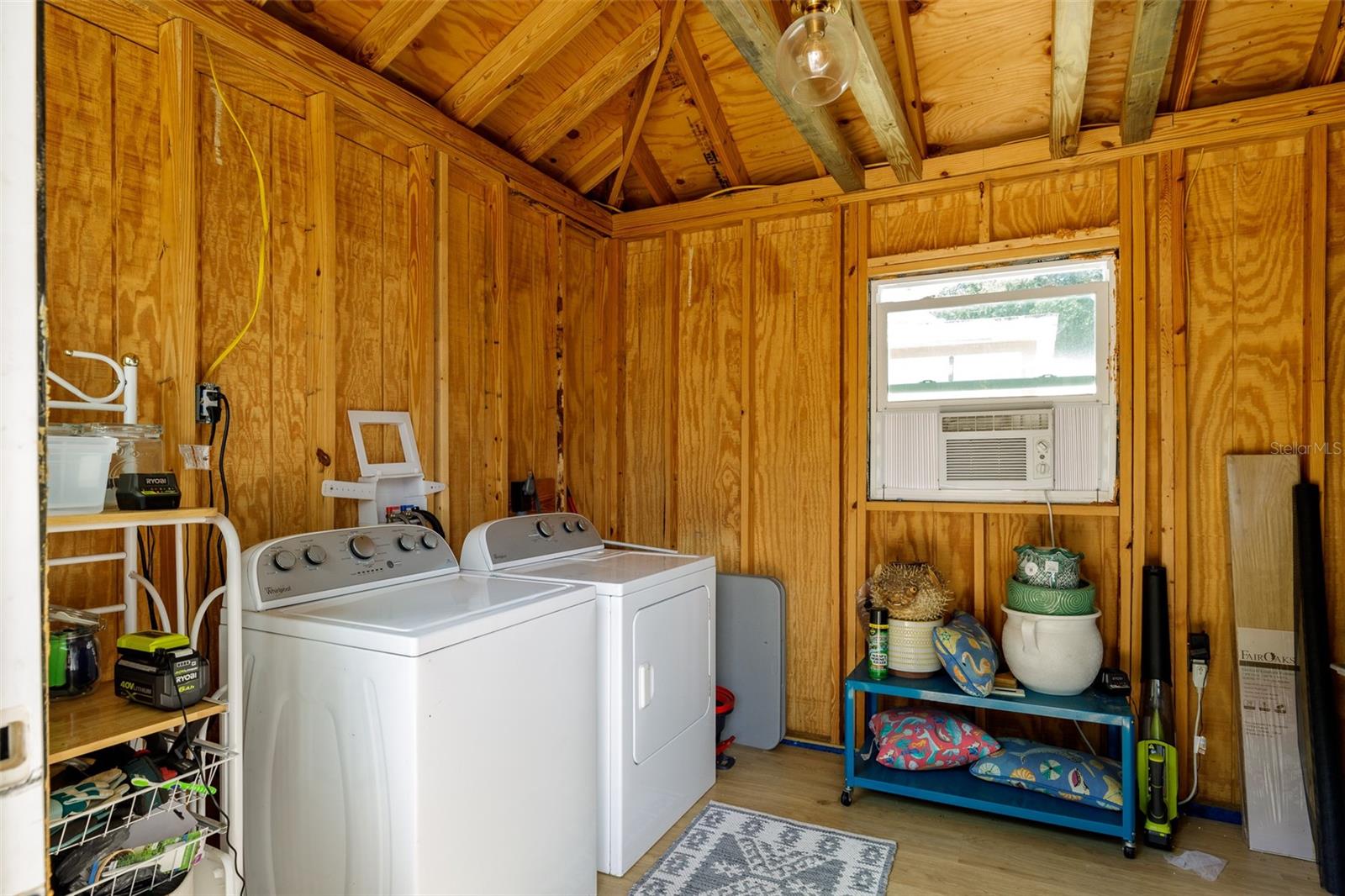 Inside shed with wall unit for comfort in those Florida hot days.