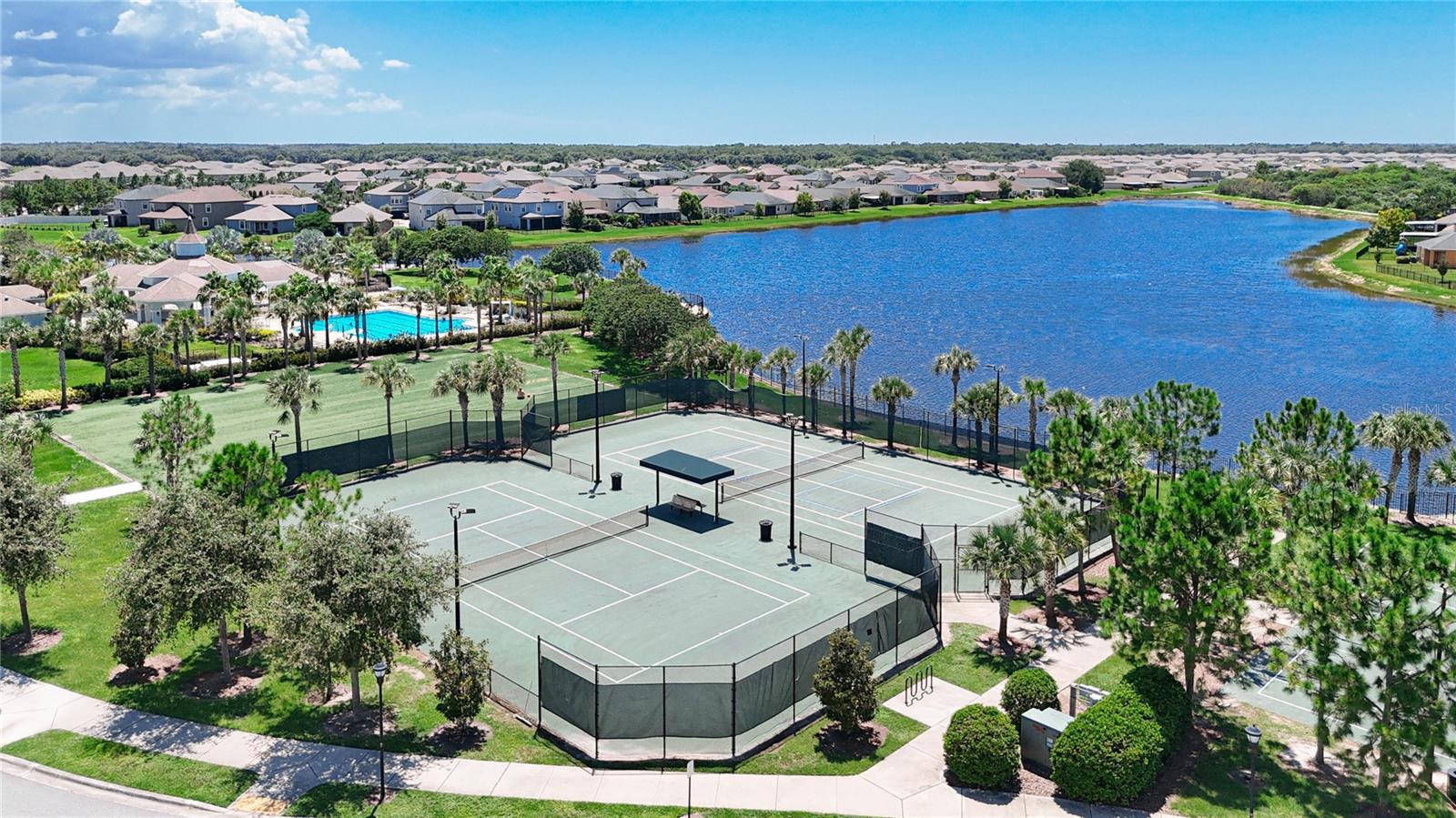 Community amenities include a resort style pool, lap pool, tennis courts, basketball court, walking trails, dog park, and a playground.