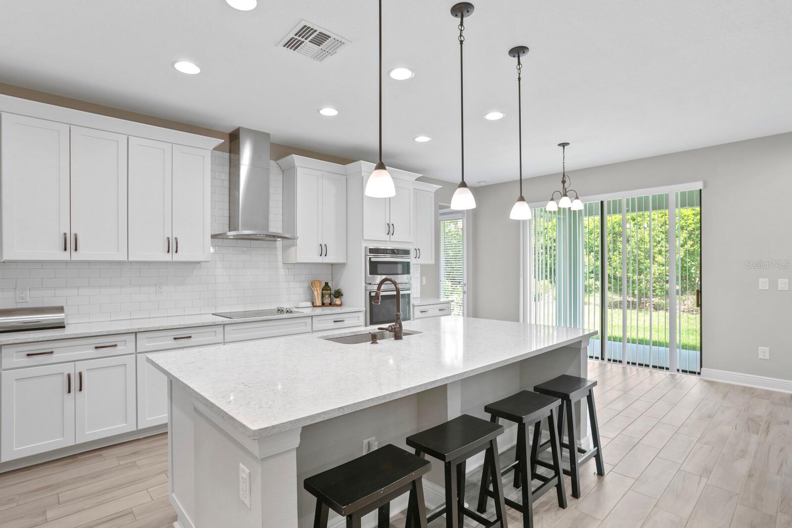 An informal dinette space is positioned by the back doors.