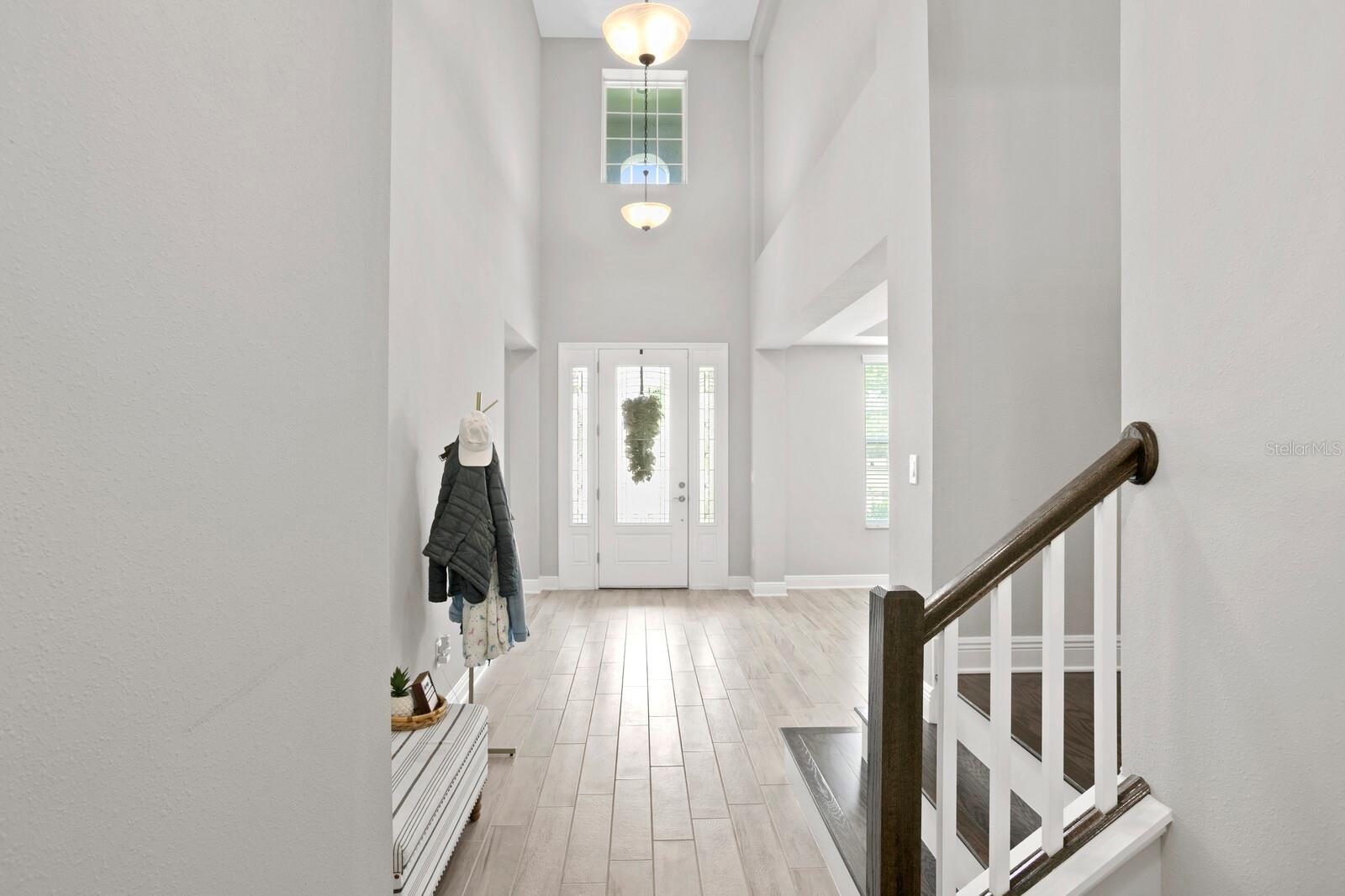 Enter into your two story foyer with abundant natural light