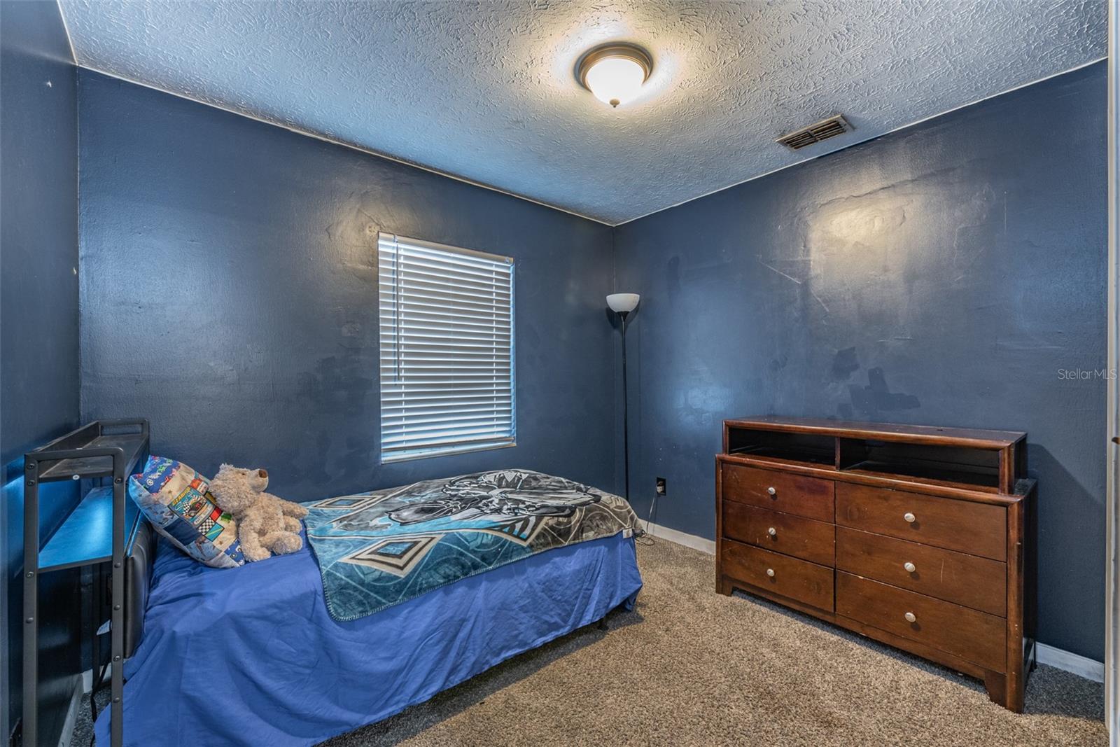 Secondary bedroom #4 is 10'x8' with a built-in closet, and recently installed carpet.