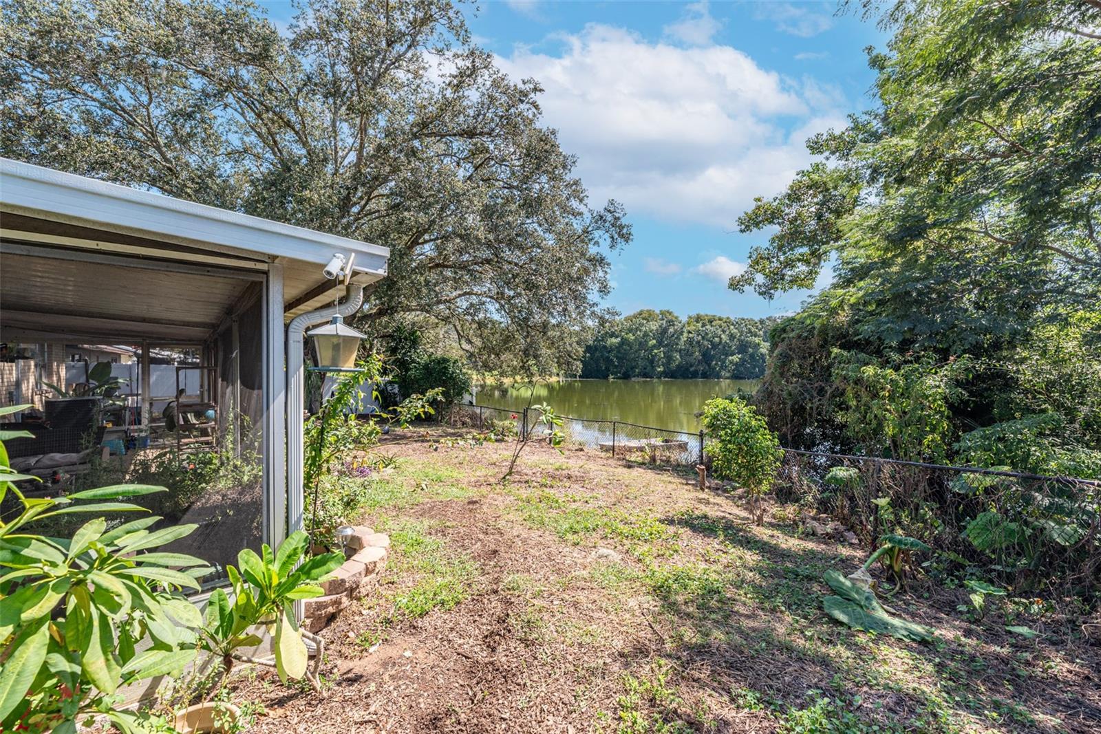 Grab your fishing pole and enjoy the florida birdlife.  Yard is completely fenced with a gate to access water.