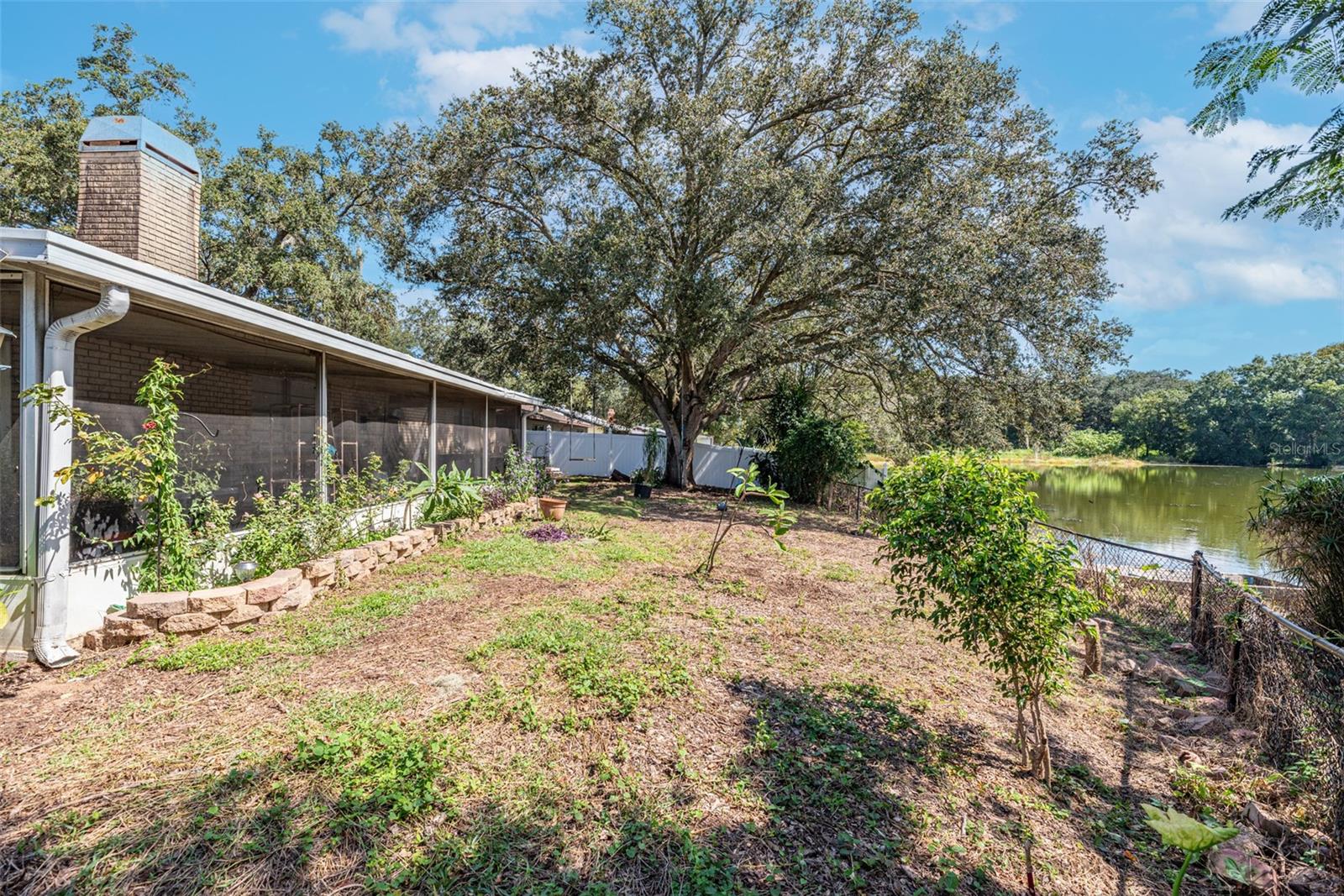 Grab your fishing pole and enjoy the florida birdlife.  Yard is completely fenced with a gate to access water.