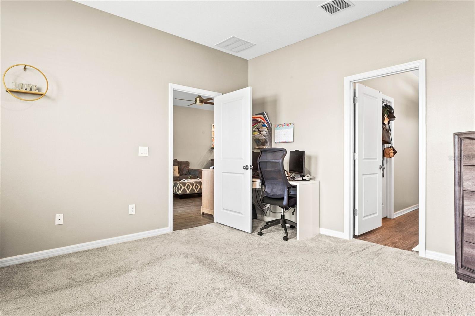 Primary suite with enough room for a desk/office space