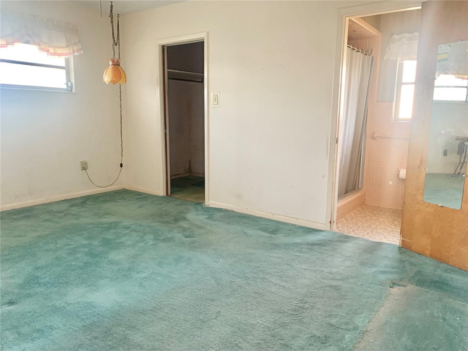 Primary Bedroom with En Suite and Walk-In Closet