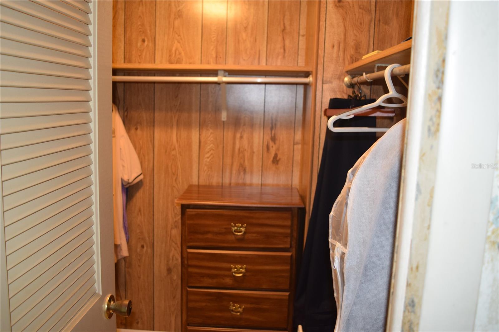 Primary bedroom walk in closet