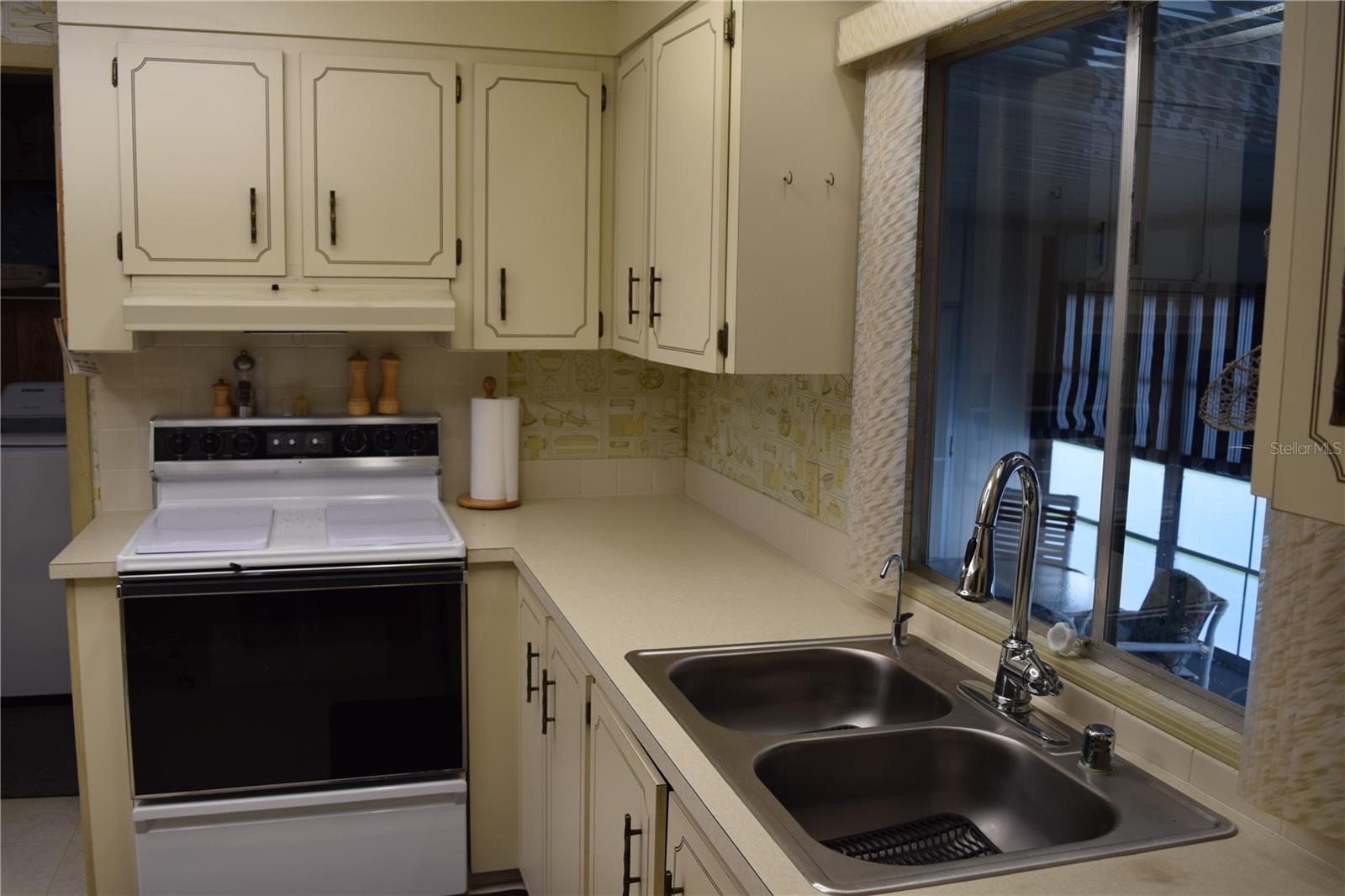 Kitchen with view to enclosed porch