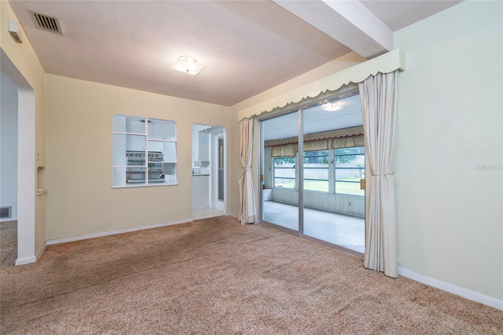 Dining Room, right off the Kitchen, with sliders to Florida Room