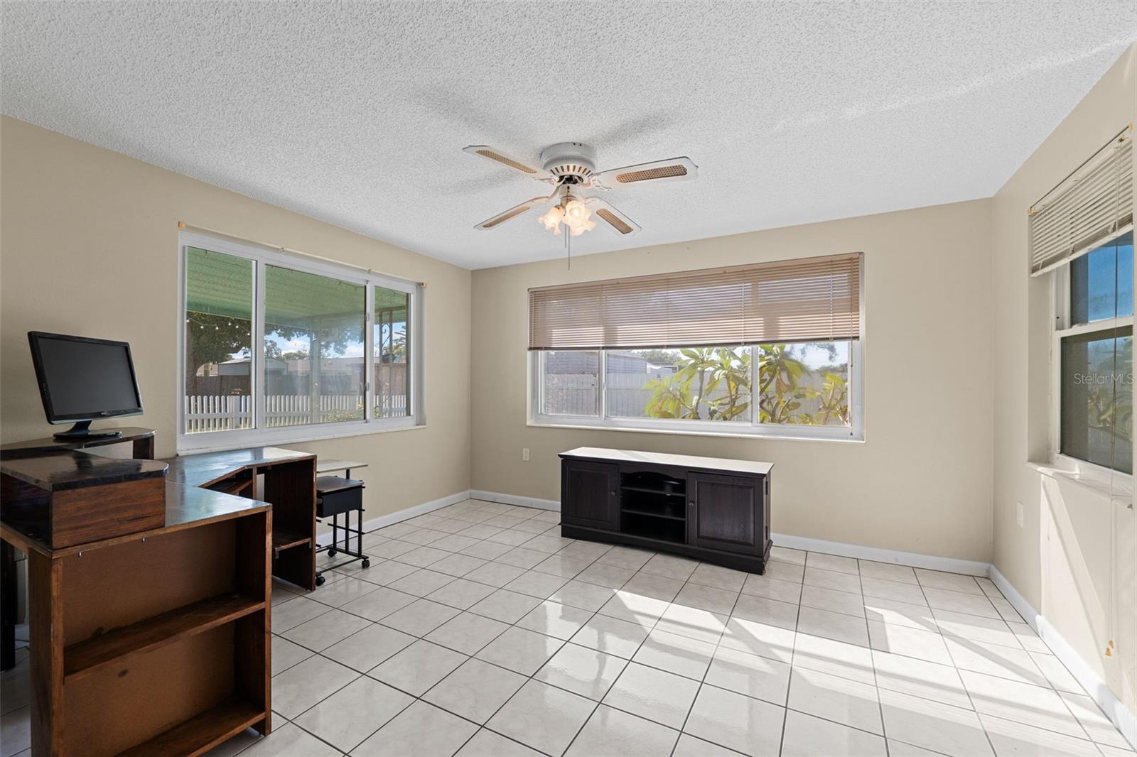 With windows on 3 sides, this room is sure to be light and bright and leads to the screened in lanai