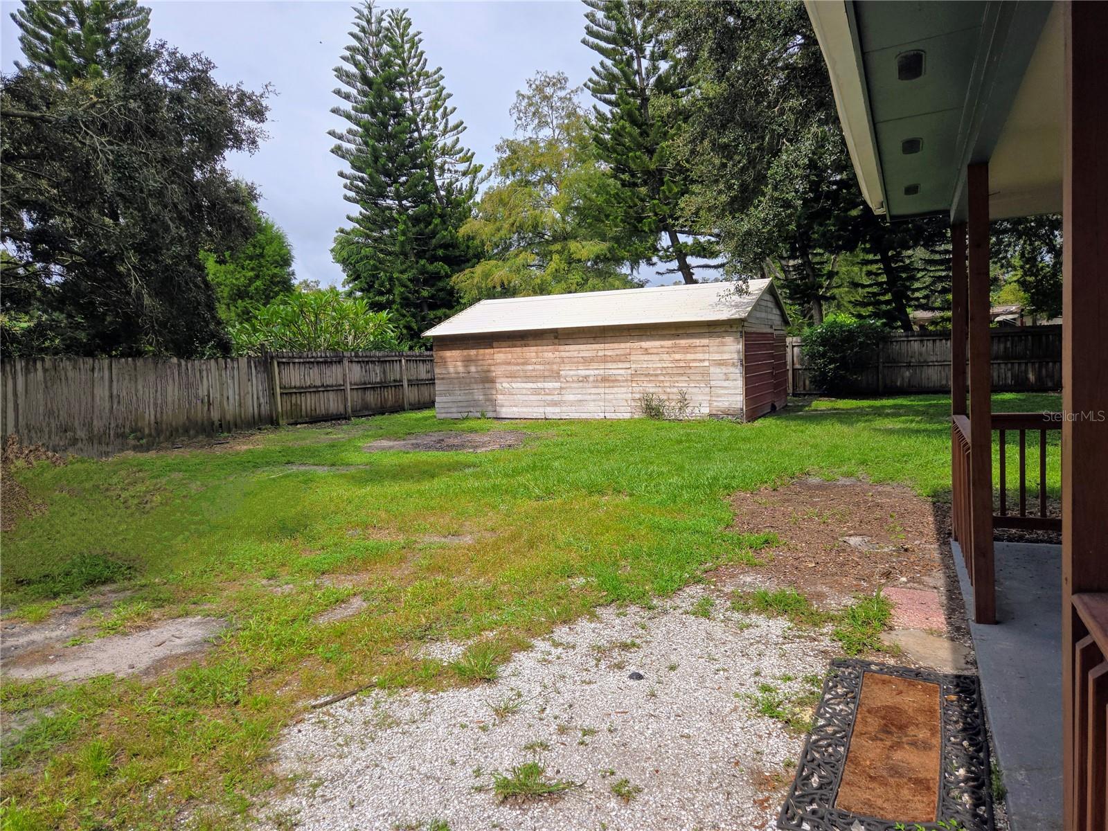 Rear yard with enclosed (used to be a boat/RV/or 2 car carport)