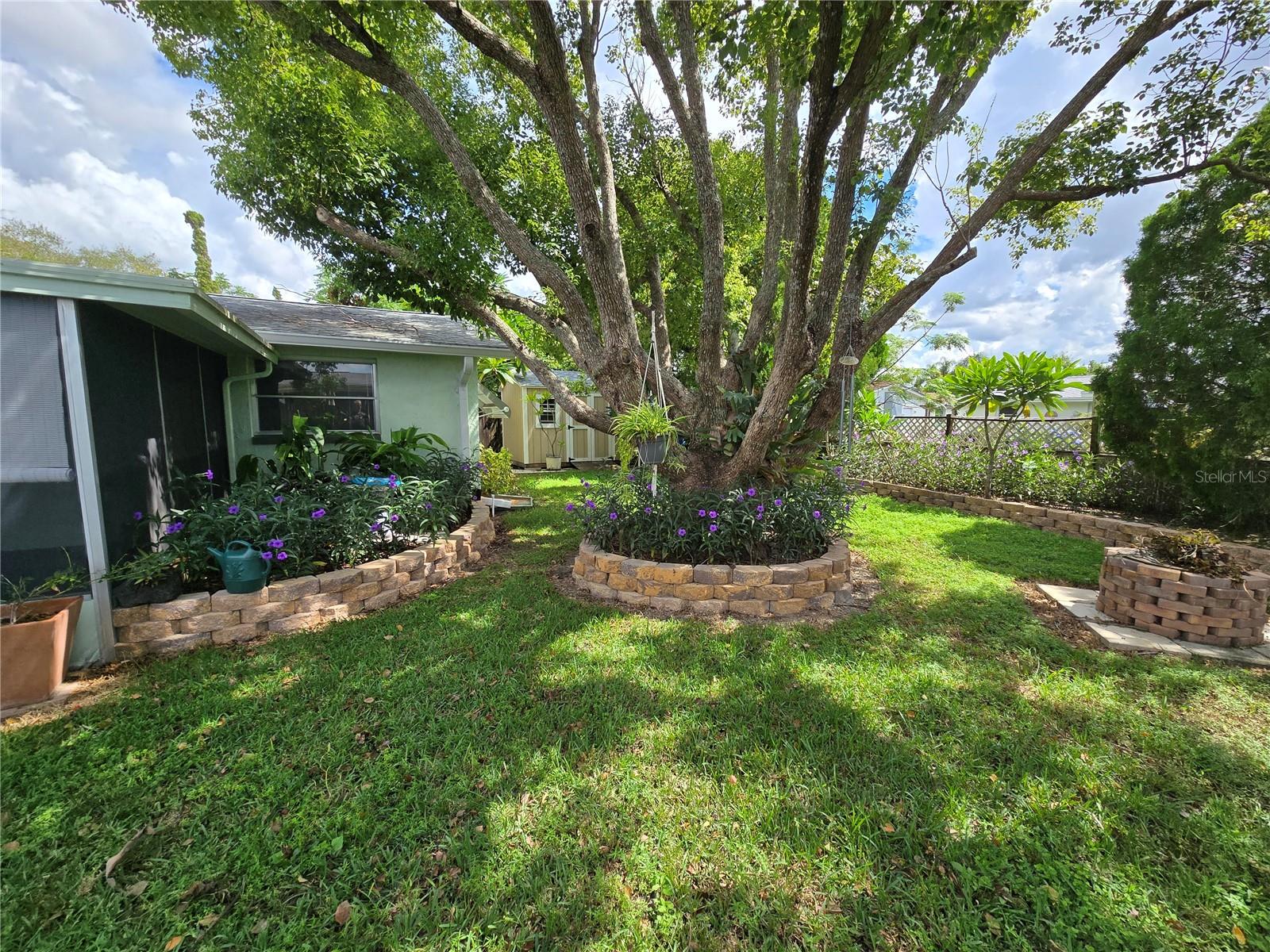 Backyard with firepit on the right - Gardeners Delight!