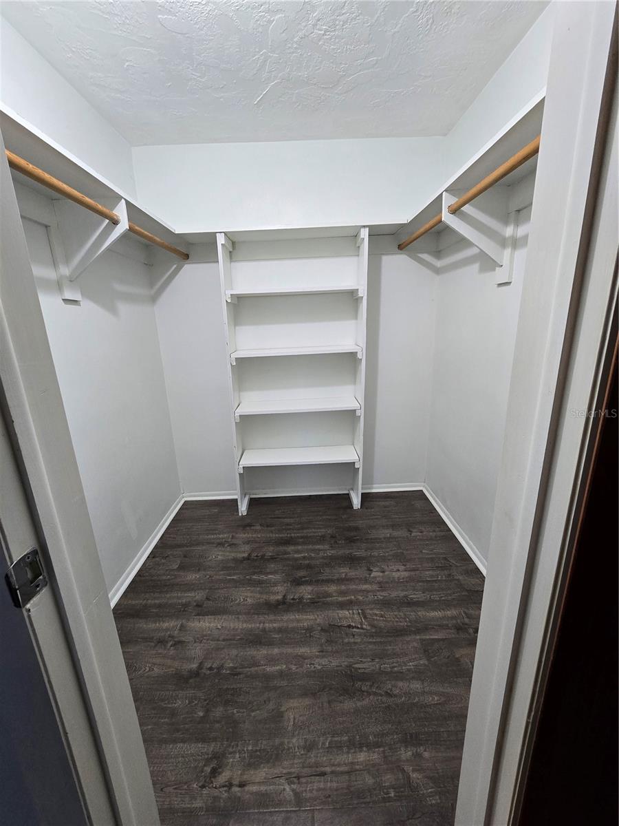 Primary Bedroom walk in closet