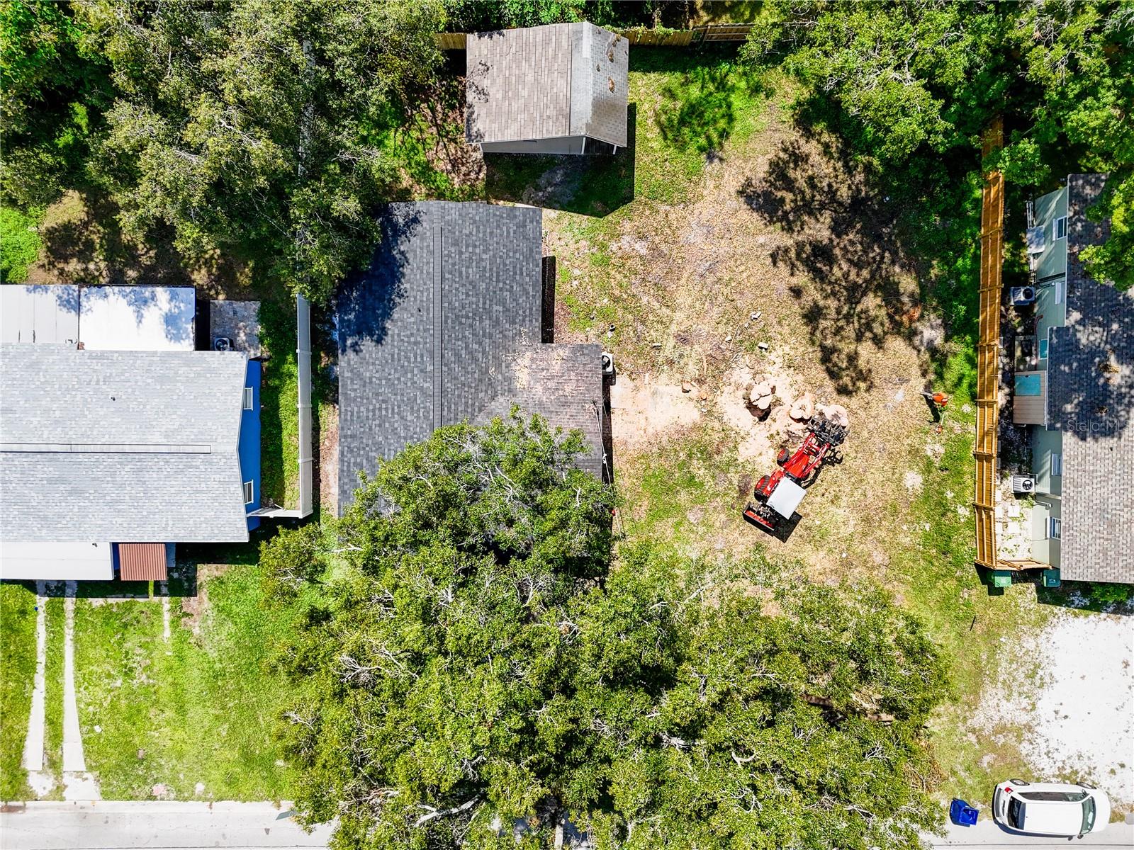 Extra large lot with large storage shed out back.