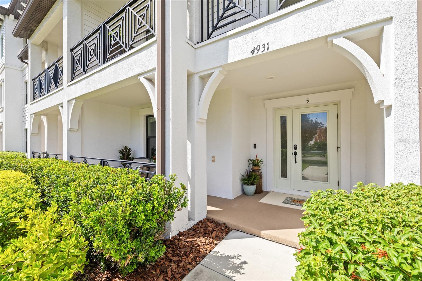 Walk-up style townhome with two outdoor balconies.