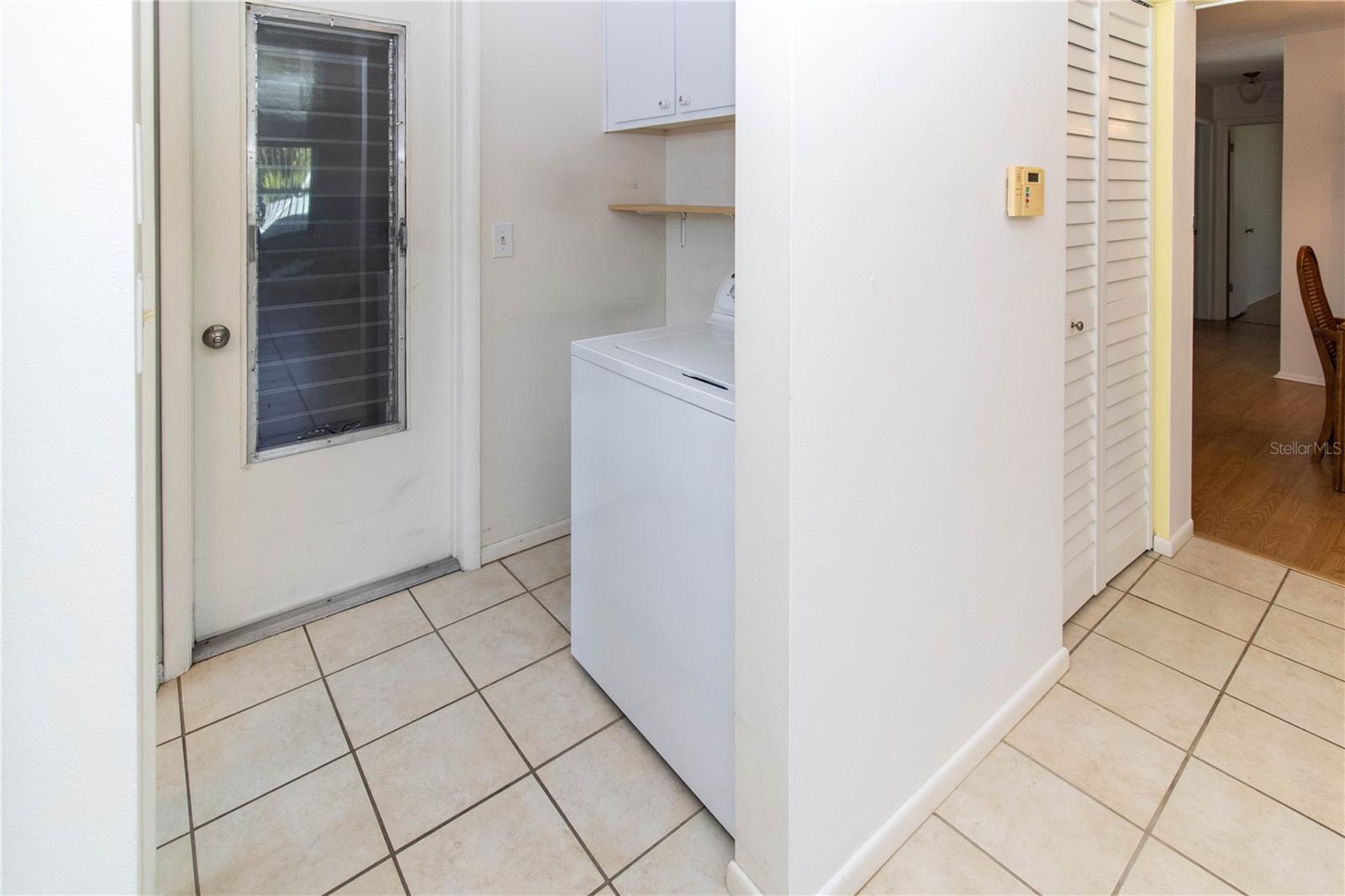 Kitchen Pantry to the Right.  Inside Washer (Dryer in Garage).  Second bath to Left.