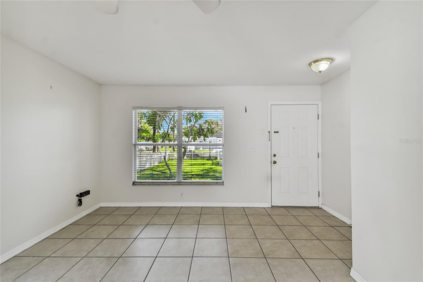 View from kitchen to front door and living area