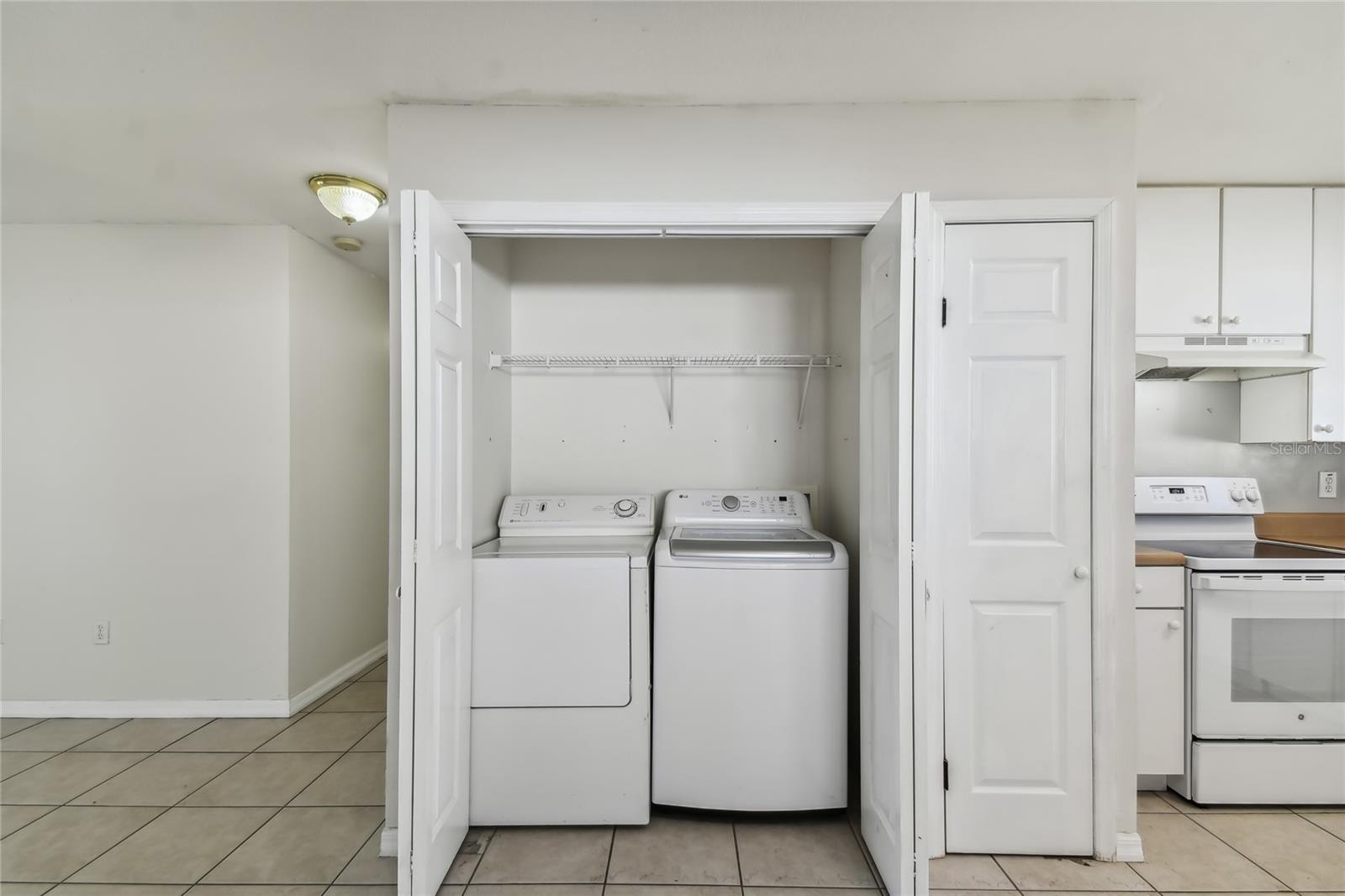 Laundry closet in kitchen area