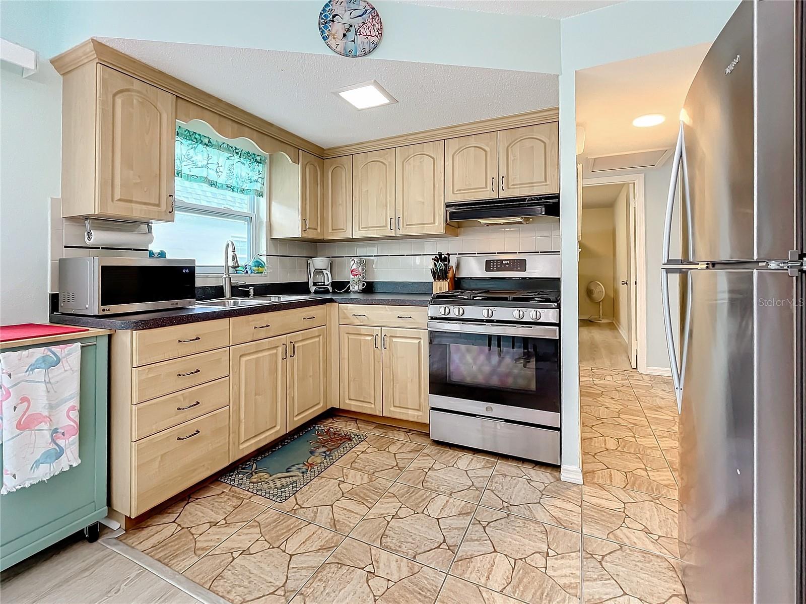 Full size kitchen with the natural gas stove