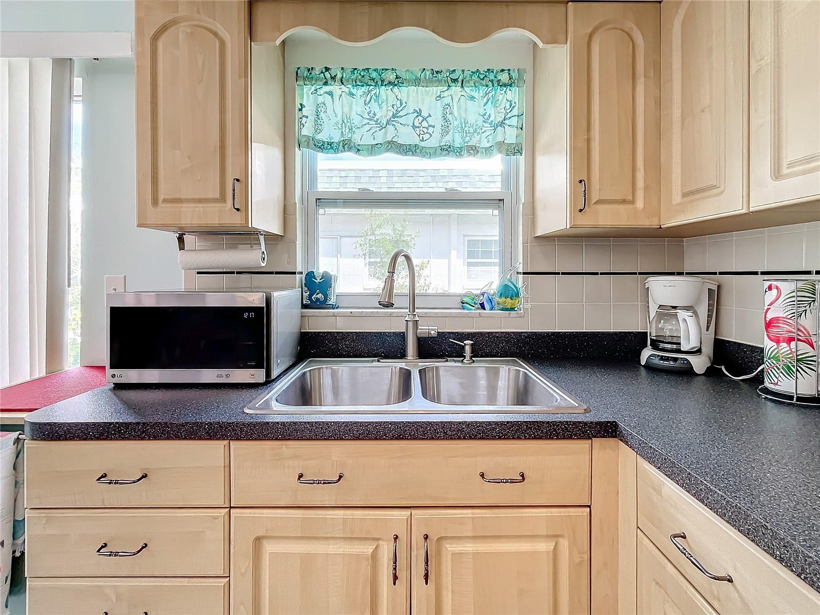 Who doesn't like to have a window in in front of the kitchen sink