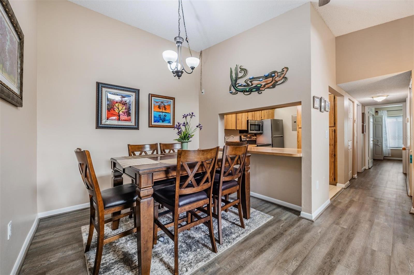 Gorgeous vinyl flooring flows throughout. The kitchen overlooks the dining room perfect for entertaining.