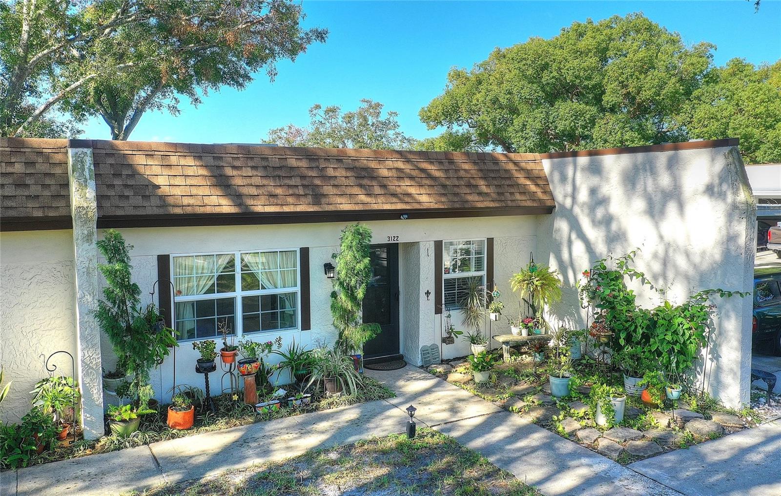 Beautiful little garden area greets you as you enter right off the parking area - short distance between car and home!