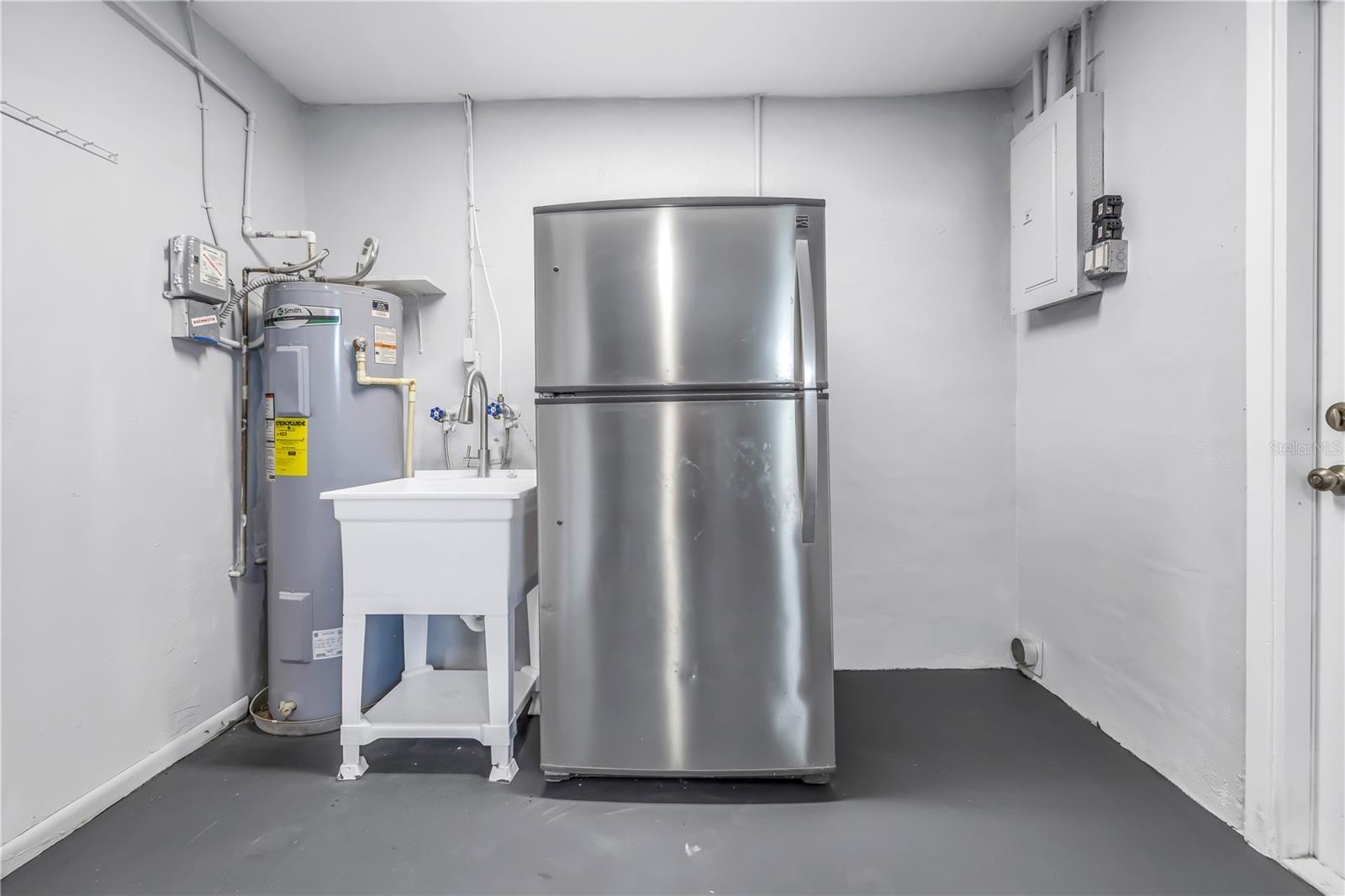 garage with extra stainless refrigerator