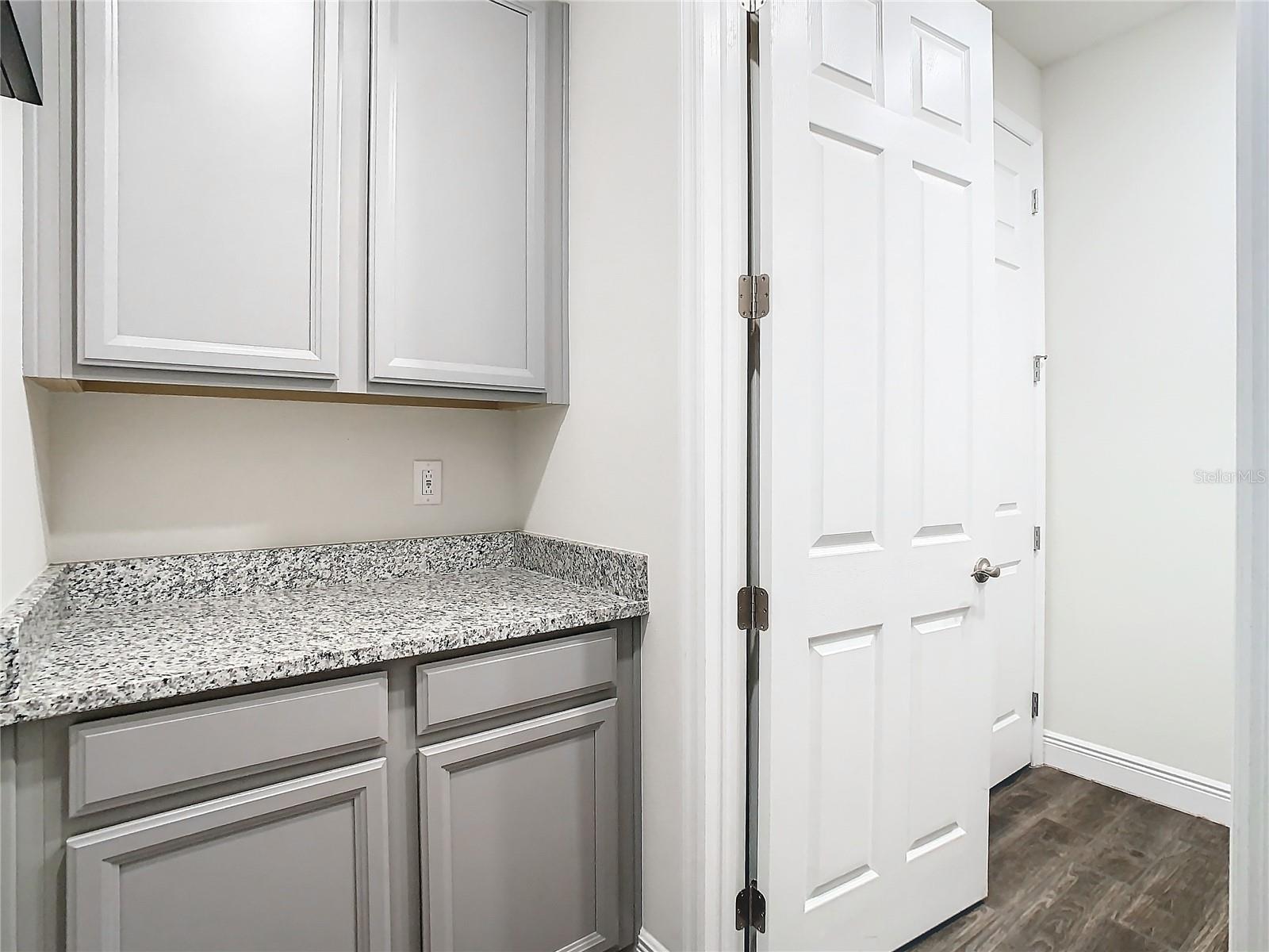 Cabinets just outside laundry room