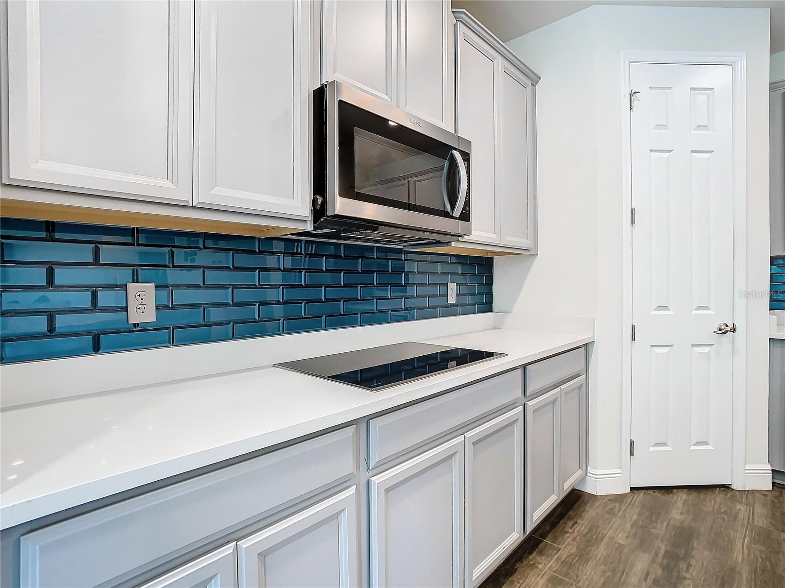 Kitchen with subway tile backsplash.