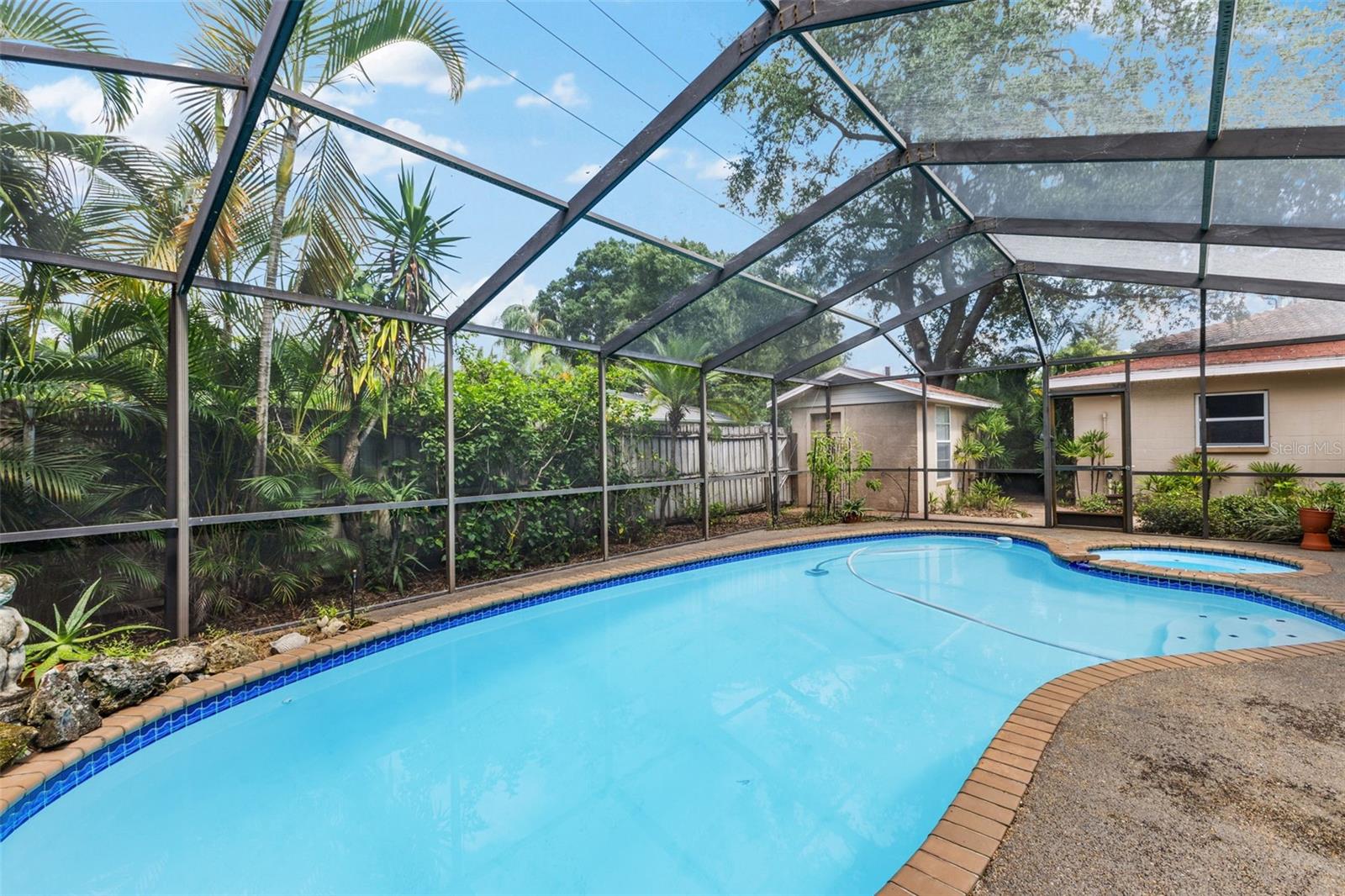 Pool Area with enclosed screen lanai