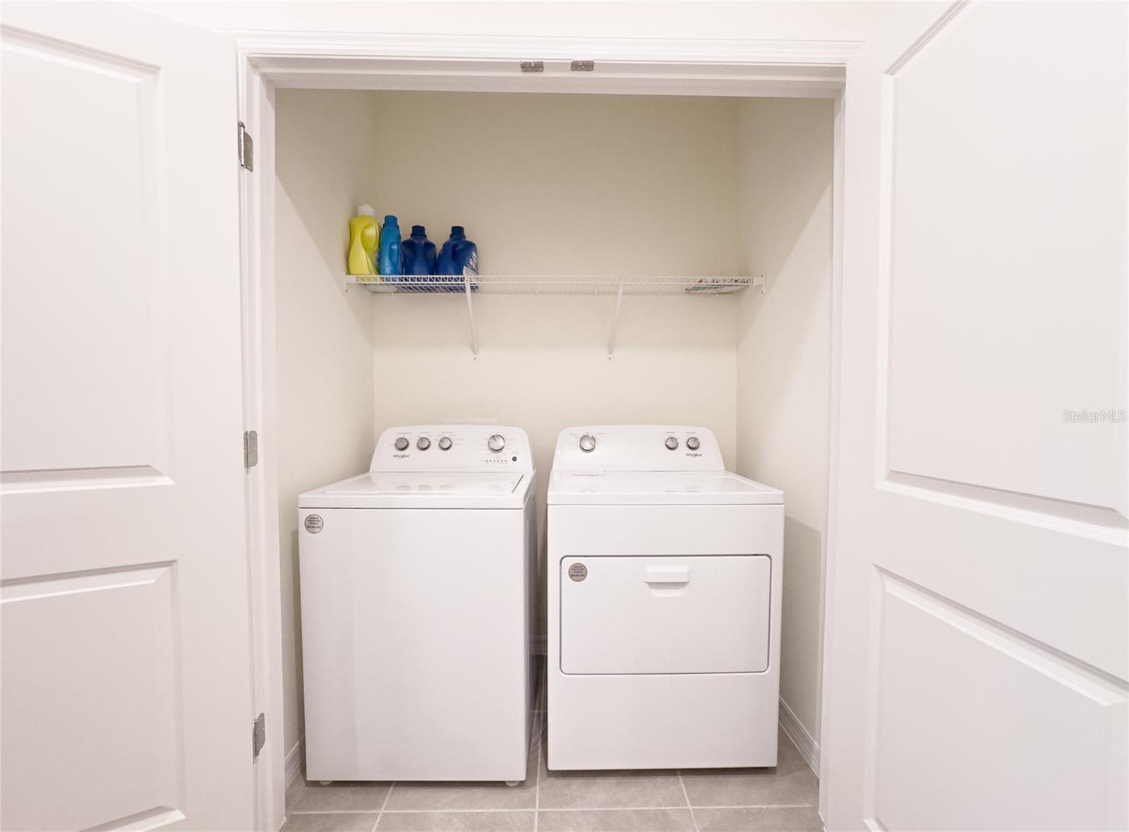 Say goodbye to laundry day hassles with this ultra-convenient upstairs laundry setup! Easy access means you can tackle those hampers without breaking a sweat. Bonus: it's just steps away from your cozy bedrooms.