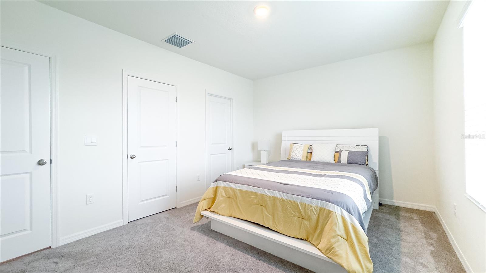 Step into your bright primary bedroom, where morning rays gently coax you awake. With ample closet space and a serene, minimalist design, this room makes every day feel like a fresh start. Plus, the soft carpet under your toes is just the right touch for those easy mornings. ????