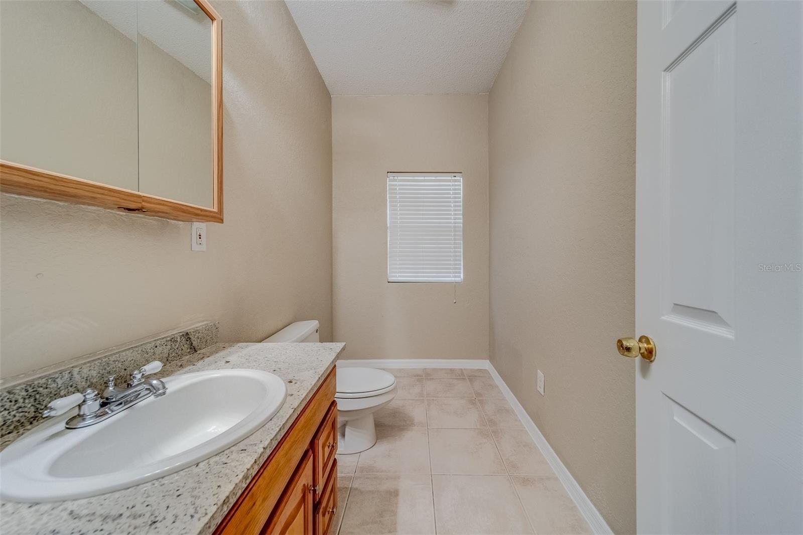 Half bathroom in between Kitchen and Garage