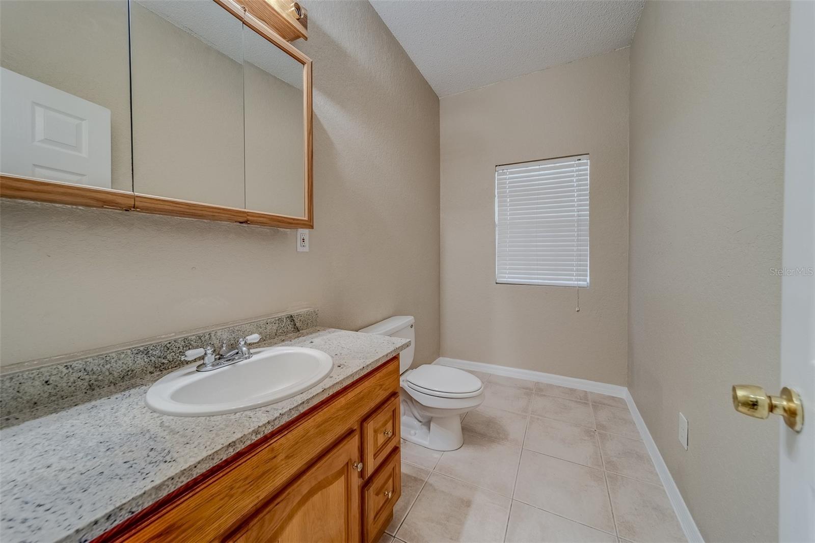 Half bathroom in between Kitchen and Garage