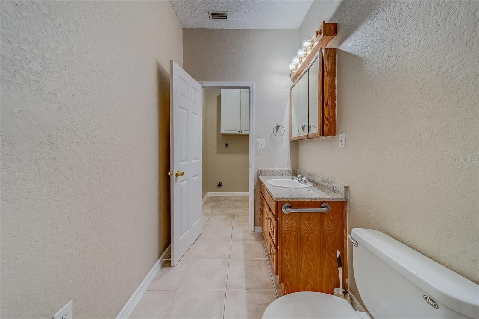 Half bathroom in between Kitchen and Garage